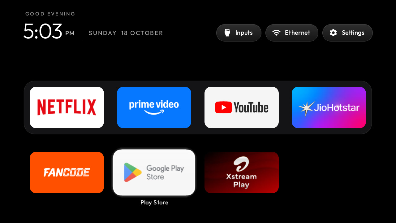 Clean Your TV 的新桌面：纯黑背景，底部 Dock 只放常用应用